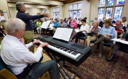 Jack Horner leads singing as Mickey McInnish plays keyboards during the Side by Side Singers practice at First United Methodist Church in Montgomery, Ala. on Tuesday October 27, 2015. The choir is made up of people with dementia, their family members and volunteers at the Respite Ministry at the church.